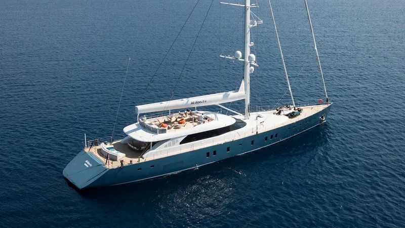 All About U Yacht Photos Pics Luxurious 2018 Ada Yacht sailing on calm blue waters, showcasing elegant design and spacious deck.