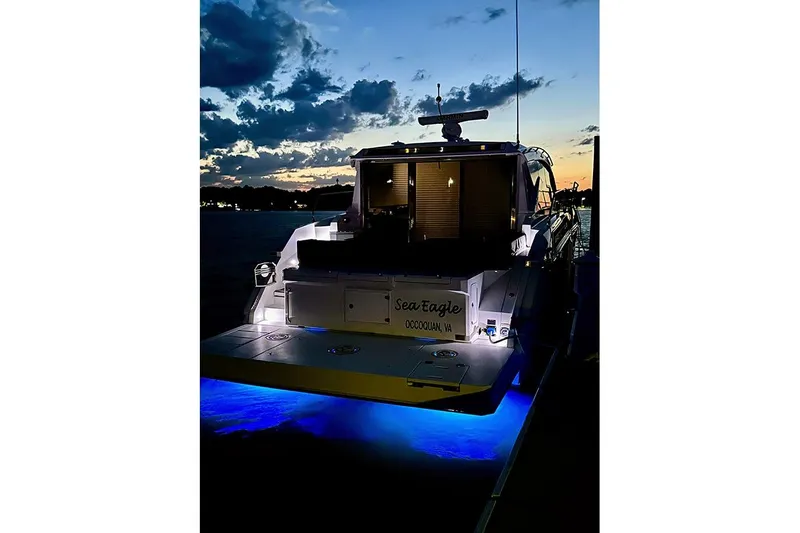  Yacht Photos Pics 2020 Cruisers Yachts 42 Cantius at sunset with blue underwater lights.