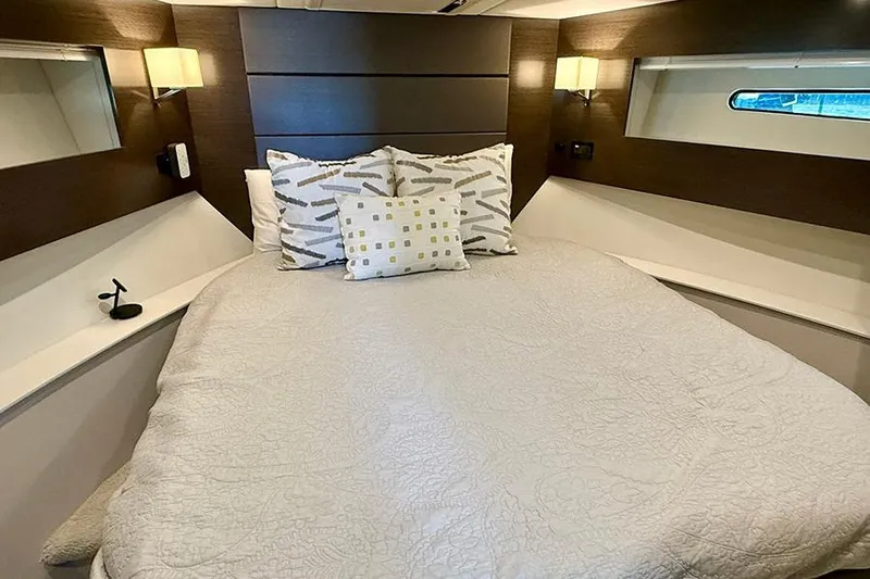  Yacht Photos Pics Luxurious bedroom interior of 2020 Cruisers Yachts 42 Cantius with modern decor.
