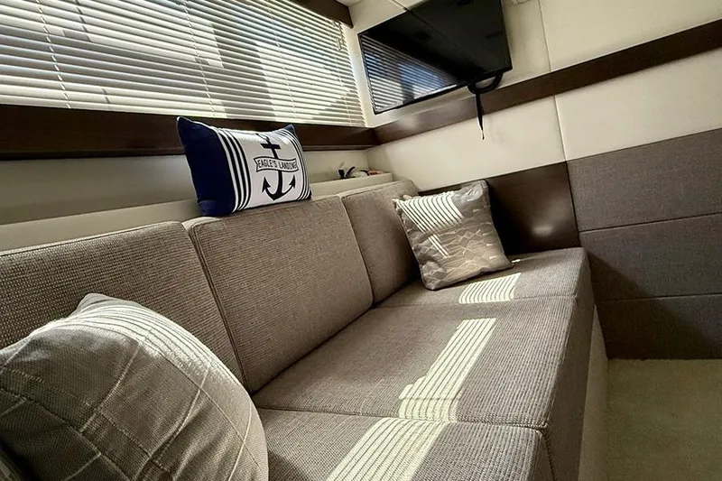  Yacht Photos Pics Interior of 2020 Cruisers Yachts 42 Cantius with cozy seating and nautical decor.