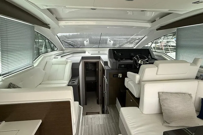  Yacht Photos Pics Luxurious interior of 2020 Cruisers Yachts 42 Cantius with modern helm and seating.