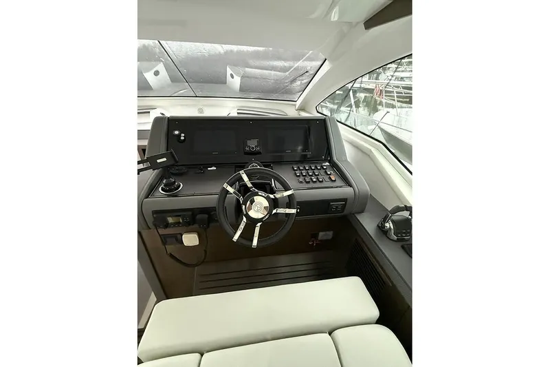  Yacht Photos Pics Helm of 2020 Cruisers Yachts 42 Cantius with modern controls and steering wheel.