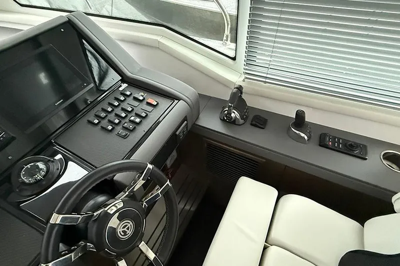  Yacht Photos Pics Helm of 2020 Cruisers Yachts 42 Cantius with modern controls and steering wheel.