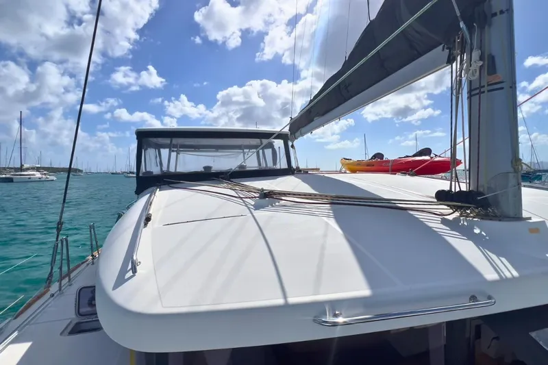 Sixtus Yacht Photos Pics 2016 Lagoon 450 s catamaran on water, sunny day, clear skies, sailboat in marina.