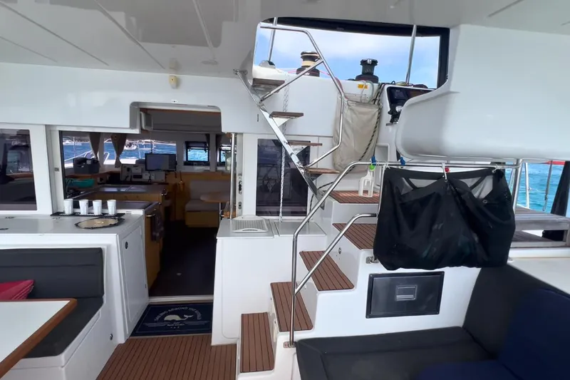 Sixtus Yacht Photos Pics Interior of 2016 Lagoon 450 S catamaran with modern seating and wooden flooring.