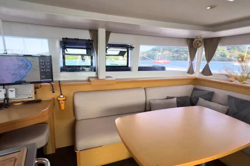 Sixtus Yacht Photos Pics Interior of 2016 Lagoon 450 s catamaran with cozy seating and navigation equipment.