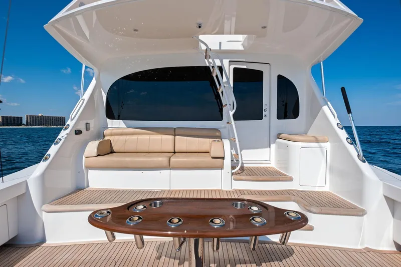 Sexy Lady Yacht Photos Pics Luxurious 2017 Viking 62 Enclosed Bridge yacht deck with seating and ocean view.