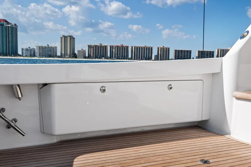 Sexy Lady Yacht Photos Pics 2017 Viking 62 Enclosed Bridge yacht deck with city skyline in background.