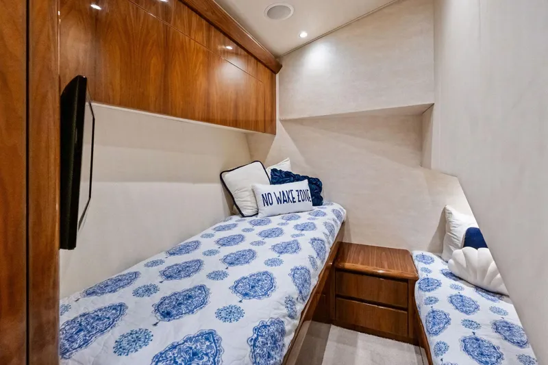 Sexy Lady Yacht Photos Pics Luxurious cabin interior of 2017 Viking 62 Enclosed Bridge yacht with twin beds.