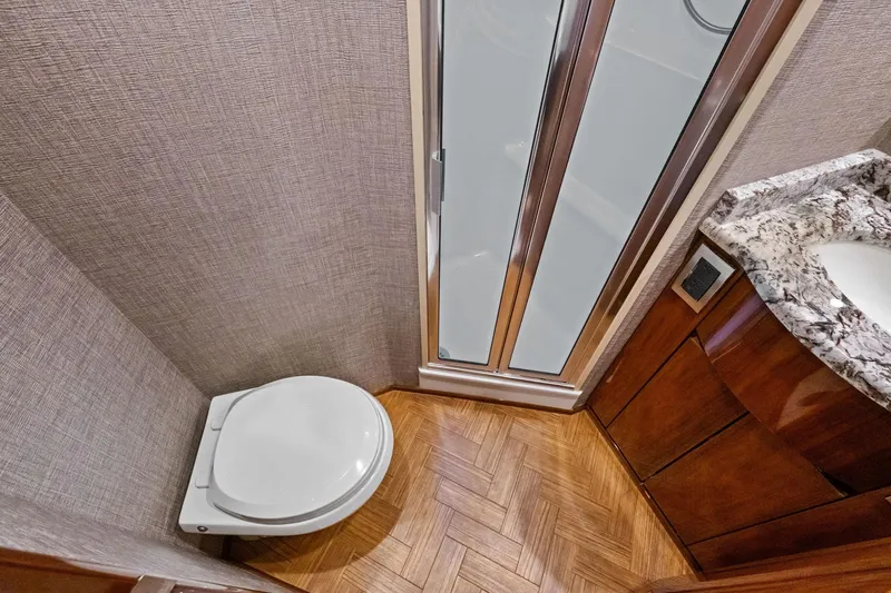 Sexy Lady Yacht Photos Pics Luxurious bathroom in 2017 Viking 62 Enclosed Bridge yacht with modern fixtures.