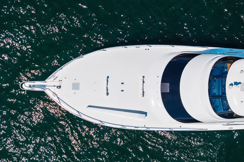 Sexy Lady Yacht Photos Pics Aerial view of 2017 Viking 62 Enclosed Bridge yacht on sparkling water.