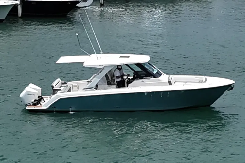  Yacht Photos Pics 2020 Tiara Sport 34 LS boat on water, side view, sleek design.