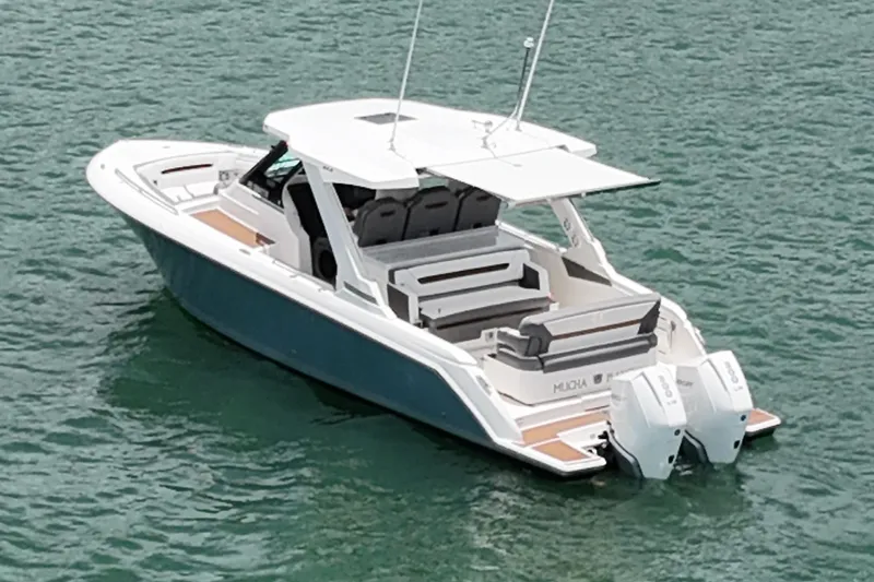  Yacht Photos Pics 2020 Tiara Sport 34 LS boat on water, featuring dual outboard engines.