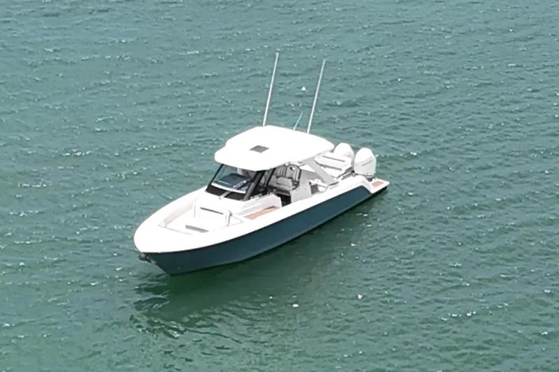  Yacht Photos Pics 2020 Tiara Sport 34 LS boat on calm water, aerial view.
