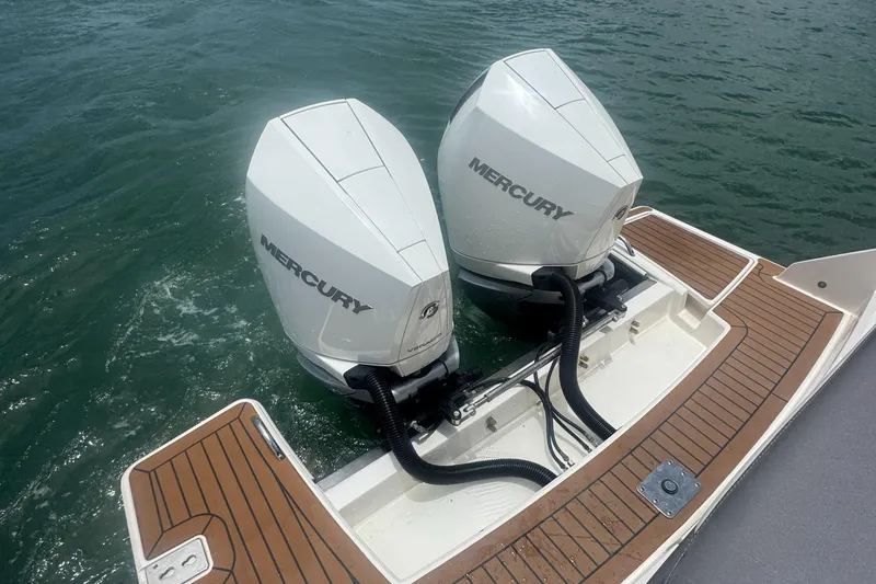  Yacht Photos Pics Twin Mercury outboard engines on 2020 Tiara Sport 34 LS boat, docked on water.