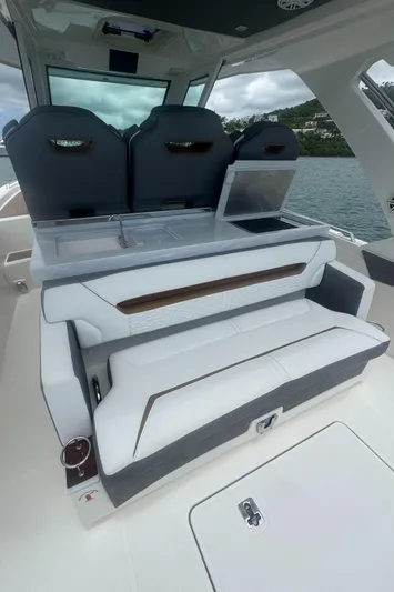  Yacht Photos Pics 2020 Tiara Sport 34 LS boat interior with seating and kitchenette area.