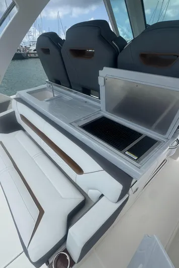  Yacht Photos Pics 2020 Tiara Sport 34 LS boat interior with seating and grill station.