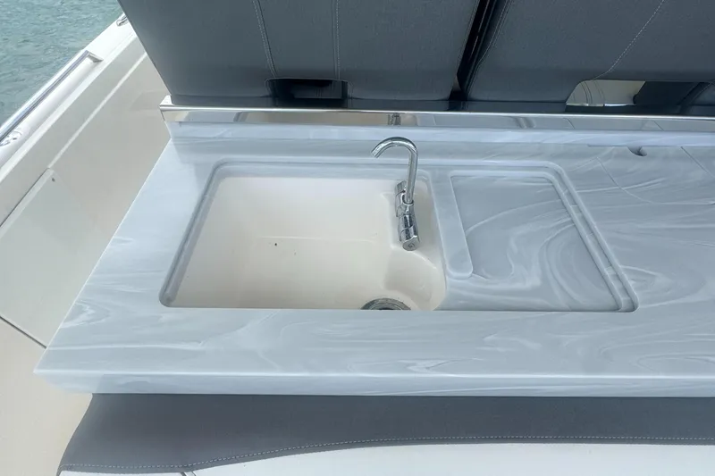  Yacht Photos Pics 2020 Tiara Sport 34 LS boat sink with sleek countertop design.