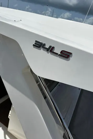  Yacht Photos Pics 2020 Tiara Sport 34 LS boat with model emblem on white surface.