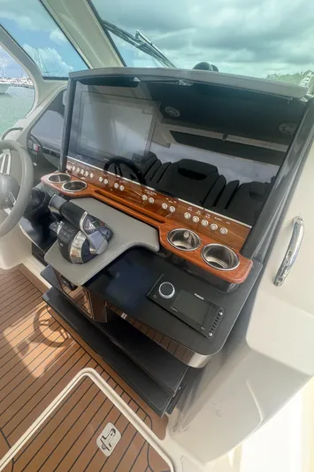  Yacht Photos Pics 2020 Tiara Sport 34 LS helm with modern controls and wood accents.