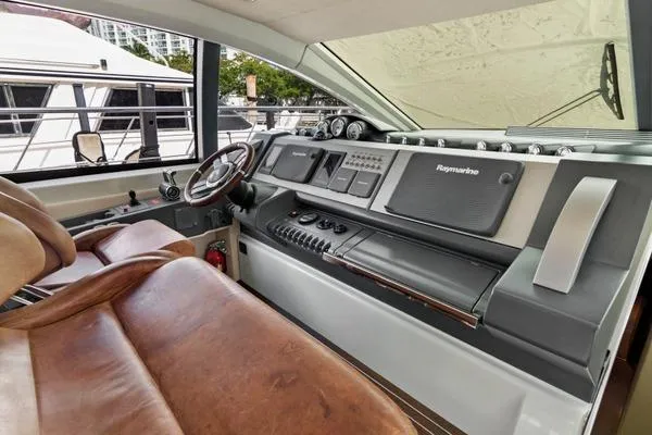  Yacht Photos Pics 2009 Azimut 68S yacht helm with leather seats and advanced navigation controls.