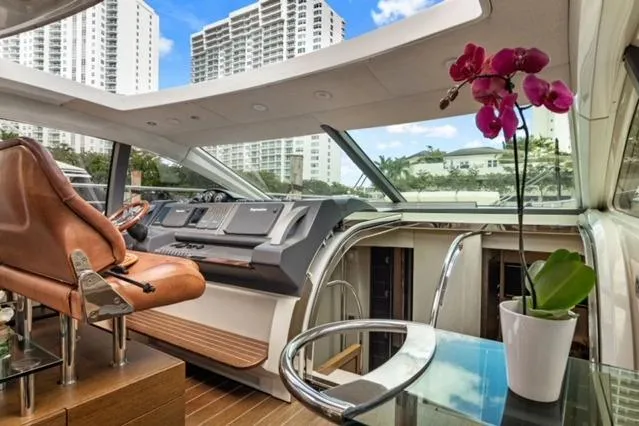  Yacht Photos Pics Luxurious 2009 Azimut 68S yacht interior with modern helm, leather seating, and vibrant orchid.