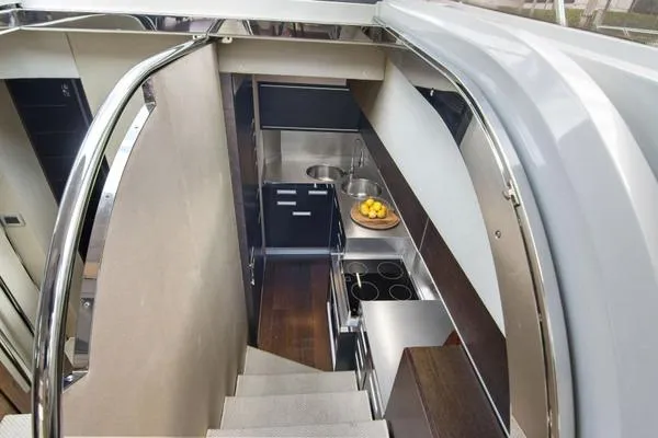  Yacht Photos Pics Modern kitchen interior of 2009 Azimut 68S yacht with sleek design and stainless steel appliances.