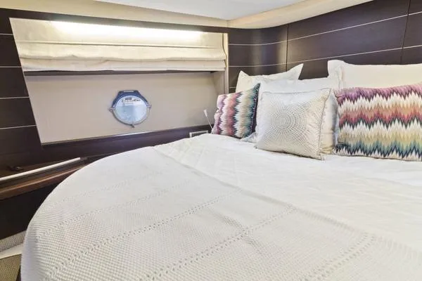  Yacht Photos Pics Luxurious bedroom interior of 2009 Azimut 68S yacht with elegant bedding and decor.