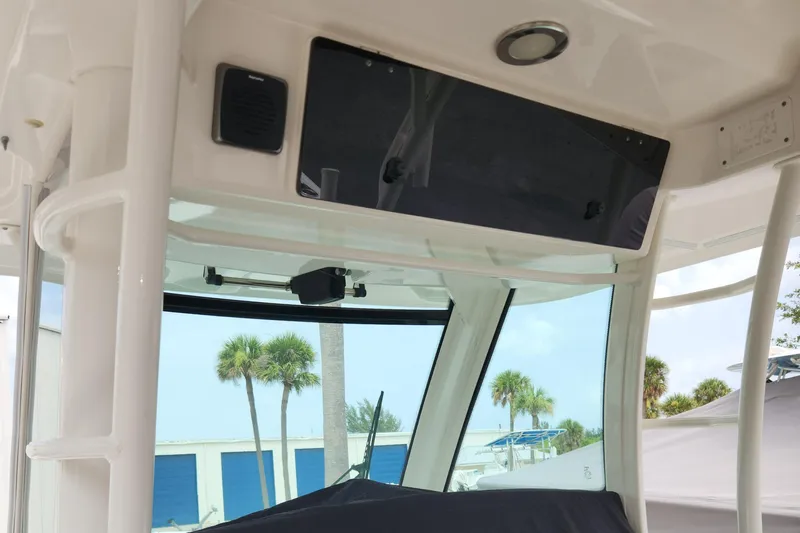 Outrageous Yacht Photos Pics 2014 Boston Whaler 350 Outrage helm station with electronics and windshield.