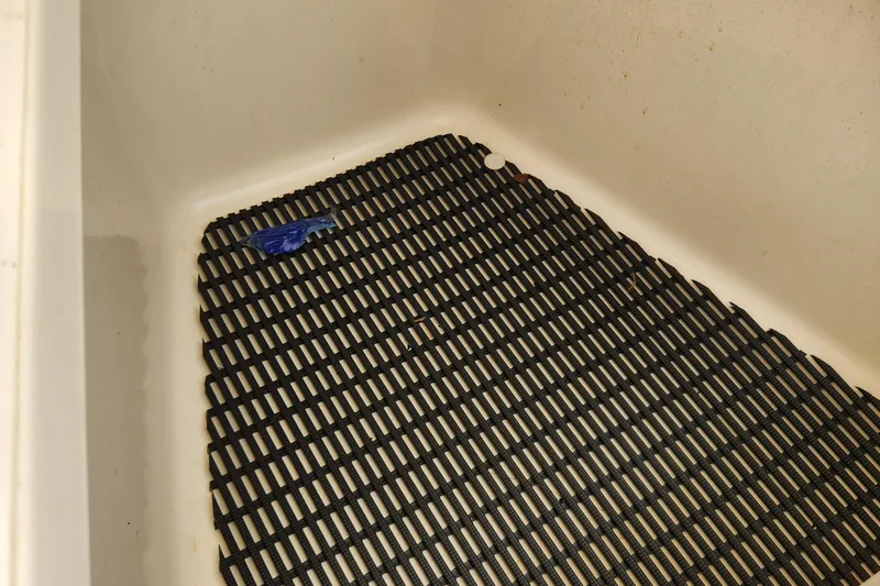 Outrageous Yacht Photos Pics Non-slip mat in the storage compartment of a 2014 Boston Whaler 350 Outrage boat.