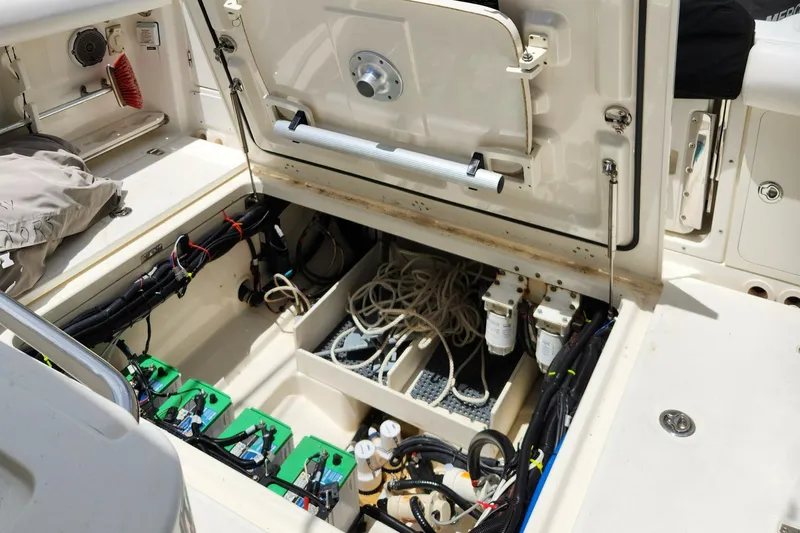 Outrageous Yacht Photos Pics 2014 Boston Whaler 350 Outrage boat interior showing battery compartment and wiring.