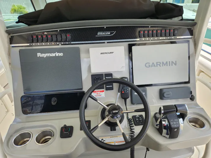 Outrageous Yacht Photos Pics 2014 Boston Whaler 350 Outrage helm with Raymarine and Garmin navigation systems.