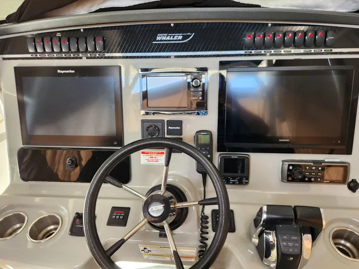 Outrageous Yacht Photos Pics 2014 Boston Whaler 350 Outrage helm with dual screens and advanced controls.