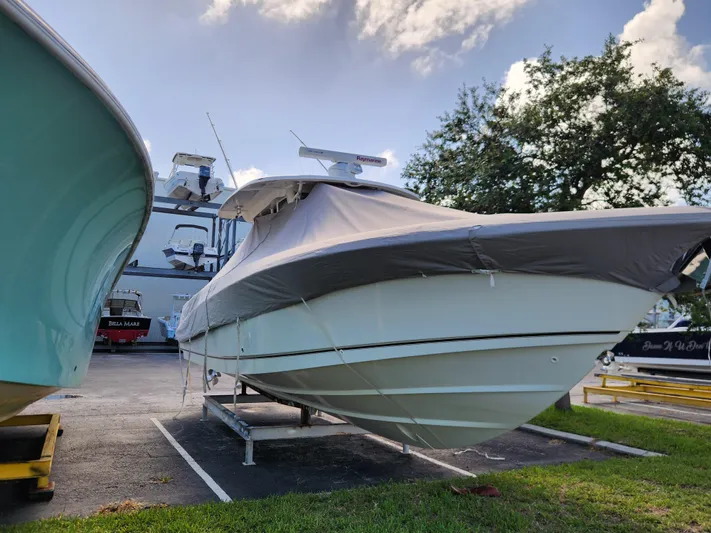 Outrageous Yacht Photos Pics 2014 Boston Whaler 350 Outrage boat covered and parked on a trailer.