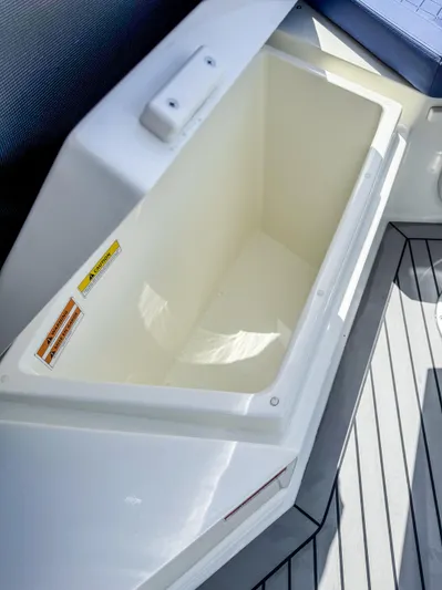  Yacht Photos Pics 2024 De Antonio Yachts D28 Open storage compartment with sleek design and spacious interior.