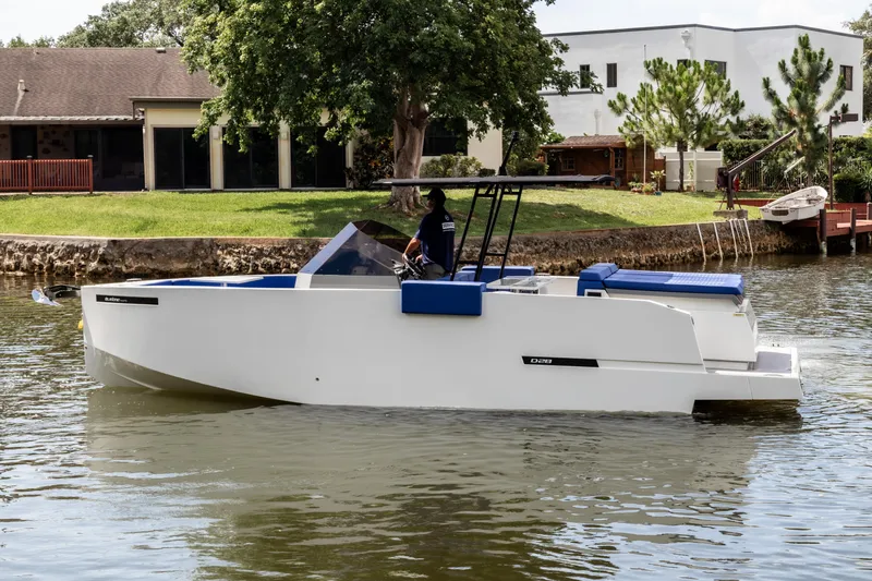  Yacht Photos Pics 2024 De Antonio Yachts D28 Open cruising on a calm river near residential area.