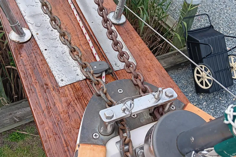 Rhythm Yacht Photos Pics Anchor chain and deck details of a 1991 Gozzard 31 sailboat.