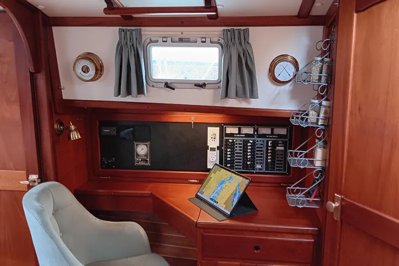 Rhythm Yacht Photos Pics Cozy 1991 Gozzard 31 yacht interior with navigation station and tablet.