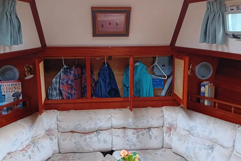 Rhythm Yacht Photos Pics Interior of 1991 Gozzard 31 sailboat with cozy seating and storage cabinets.