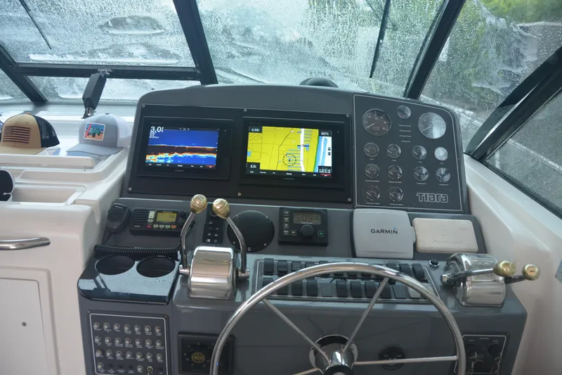 Sea Time Yacht Photos Pics Helm of 2001 Tiara Yachts 4100 Open, helm, navigation screens and controls.