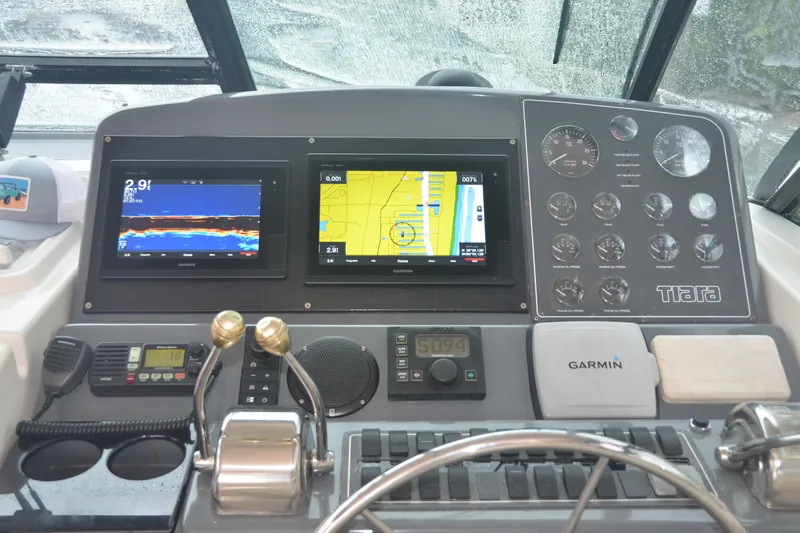 Sea Time Yacht Photos Pics Dashboard of a 2001 Tiara Yachts 4100 Open with navigation and control instruments.