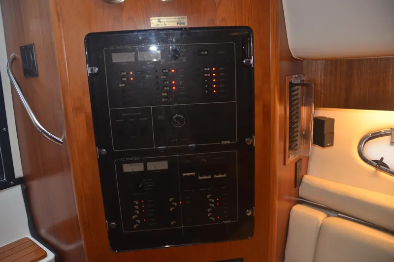 Sea Time Yacht Photos Pics Electrical panel inside a 2001 Tiara Yachts 4100 Open, featuring DC and AC systems.