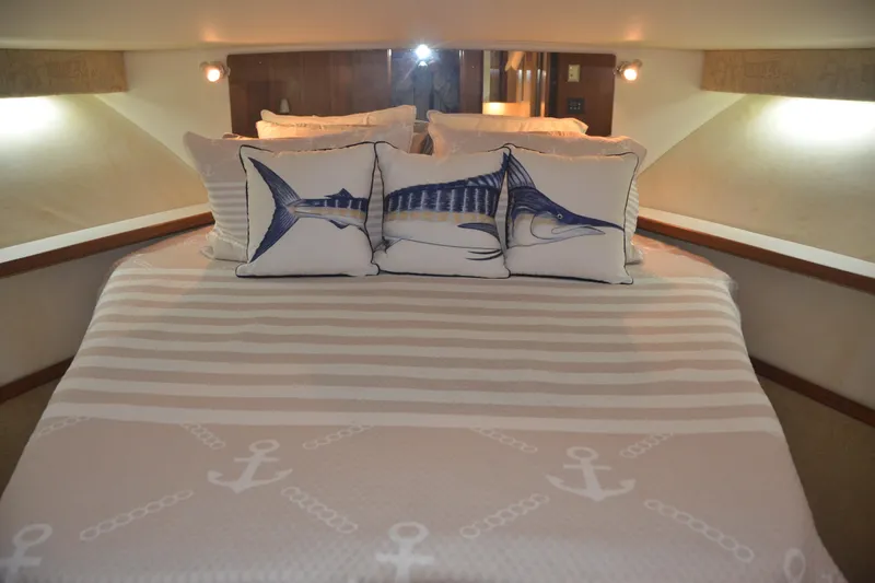 Sea Time Yacht Photos Pics Cabin interior of 2001 Tiara Yachts 4100 Open with nautical-themed bedding.