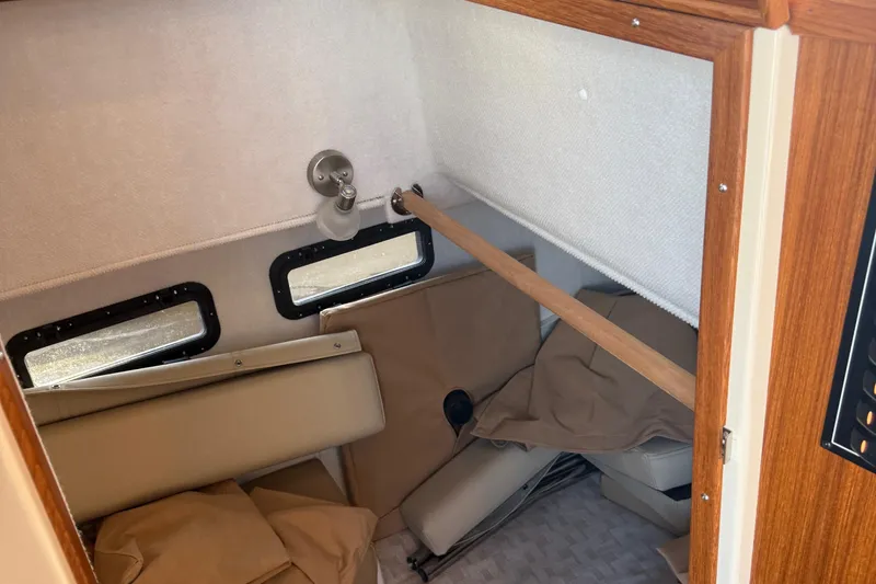  Yacht Photos Pics 2024 Ranger Tugs R31CB interior cabin with windows and seating area.