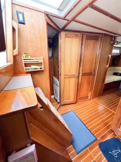 Alacrity Yacht Photos Pics Interior of 1998 Saga 43 sailboat with wooden cabinetry and flooring.