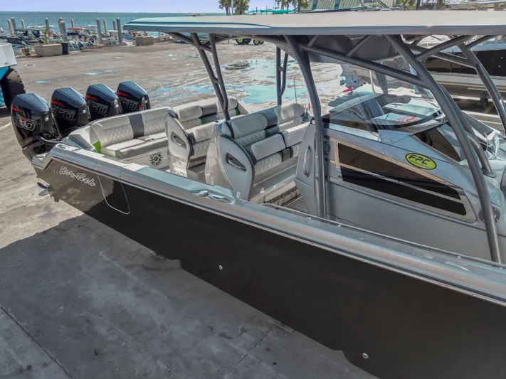  Yacht Photos Pics 2021 Nor-Tech 390 Sport Center Console boat with quad engines, docked at marina.