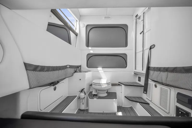  Yacht Photos Pics 2021 Nor-Tech 390 Sport Center Console cabin interior with seating and storage.