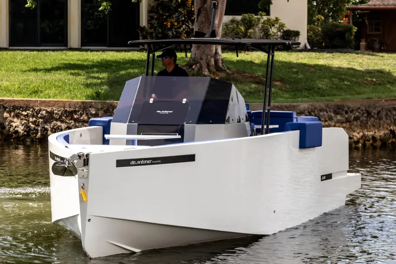  Yacht Photos Pics 2024 De Antonio Yachts D28 Open cruising on a calm waterway, showcasing sleek design.