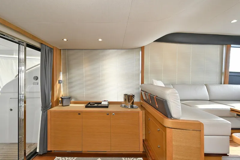 "about Time" Yacht Photos Pics Luxurious interior of 2016 Princess 52 Flybridge Yacht with modern furnishings and elegant design.