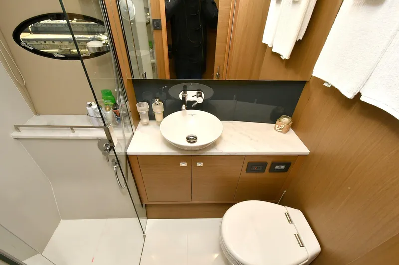 "about Time" Yacht Photos Pics Luxurious bathroom in a 2016 Princess 52 Flybridge Yacht, featuring modern fixtures and elegant design.